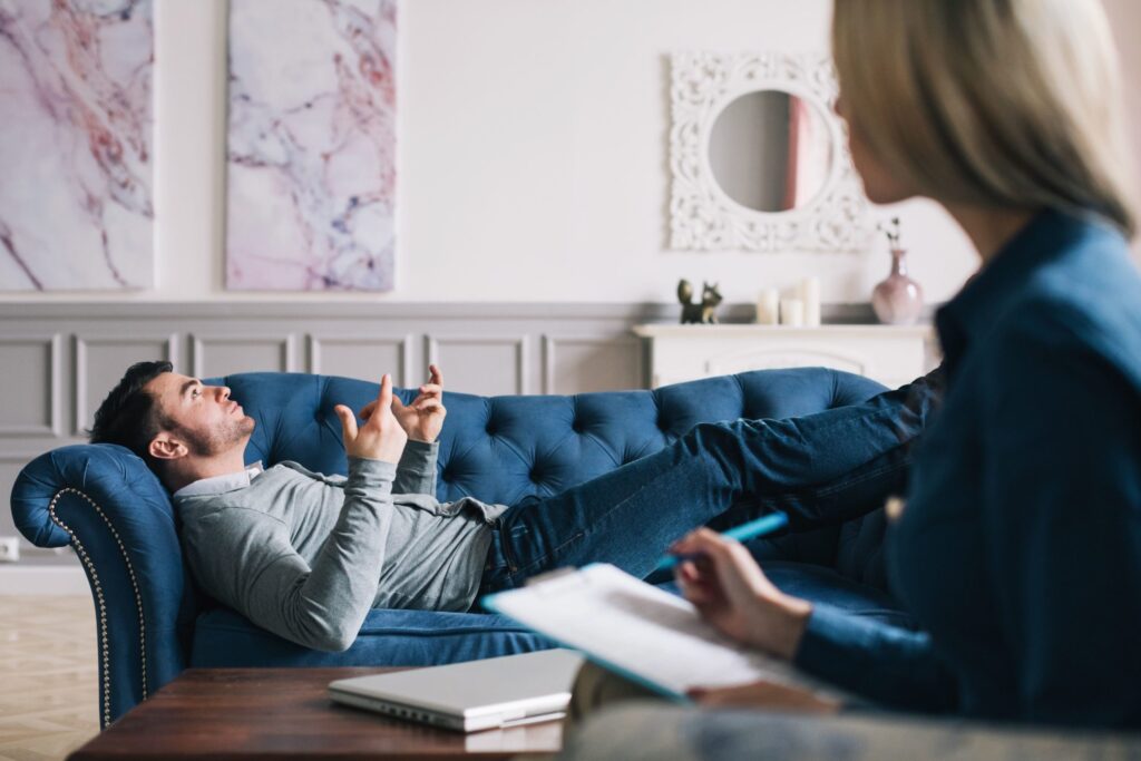 A person starting therapy after realizing what to ask a psychologist.